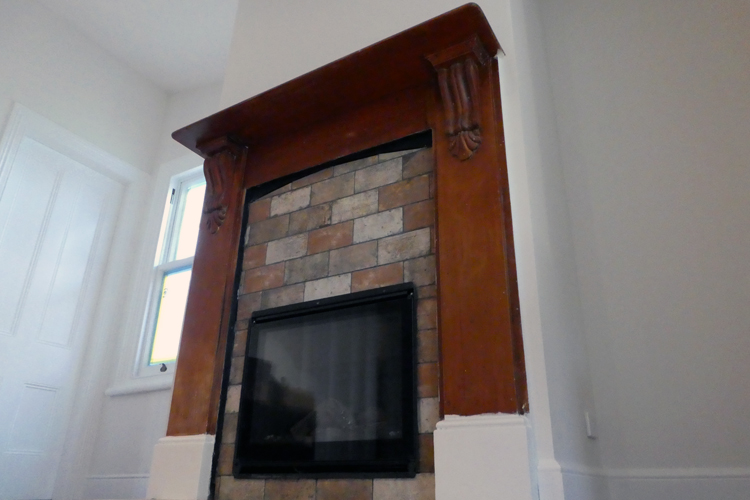 fireplace before being sanded with white door and window