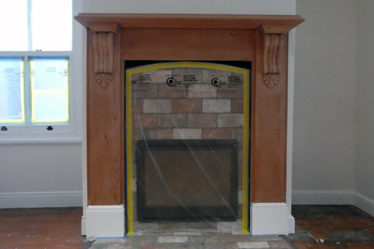 sanded fireplace with white wooden window